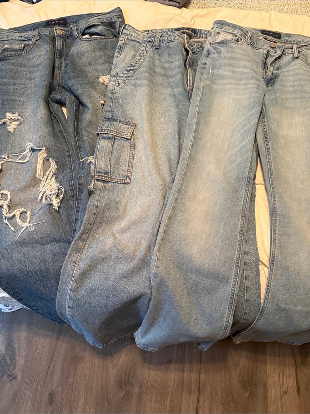 Three Pairs of Aeropostale size 8R jeans - one flare boot, one ripped, and cargo
